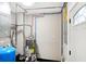 Plumbing and electrical systems are clearly visible and well-organized in the utility room at 6104 Gifford St, Indianapolis, IN 46228
