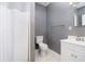 A minimalist bathroom with neutral tones, a standing shower, and tiled floors at 647 Mulford Ct, Indianapolis, IN 46234