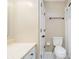 A functional bathroom with a toilet, shower with curtain, and vanity sink at 647 Mulford Ct, Indianapolis, IN 46234