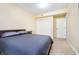 Bedroom featuring a comfortable bed, large closet, and ample natural light at 647 Mulford Ct, Indianapolis, IN 46234