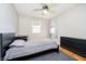 Bedroom with hardwood floors, a dresser, desk, and a window with natural light at 647 Mulford Ct, Indianapolis, IN 46234