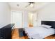 Bedroom with hardwood floors, closet, and a window with natural light at 647 Mulford Ct, Indianapolis, IN 46234