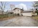 Home exterior with two-car garage, stone accents, and a spacious driveway at 647 Mulford Ct, Indianapolis, IN 46234
