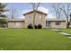 Charming stone two-story home with a well-manicured lawn at 647 Mulford Ct, Indianapolis, IN 46234
