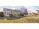 Large yard with a patio and seating area that overlooks manicured landscaping and large windows at 649 Hummingbird Dr, Brownsburg, IN 46112