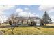 Landscaped backyard featuring a patio, lawn, and mature trees, perfect for outdoor living and entertaining at 649 Hummingbird Dr, Brownsburg, IN 46112