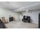 Finished basement area with a functional workspace, including a desk, chair, and additional seating at 649 Hummingbird Dr, Brownsburg, IN 46112