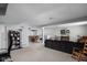 Spacious basement featuring a neutral color palette, comfortable seating, and an adjacent dining area at 649 Hummingbird Dr, Brownsburg, IN 46112
