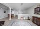 Open basement area featuring a dining table, toys, and an open view of a kitchenette at 649 Hummingbird Dr, Brownsburg, IN 46112