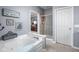 Bathroom with separate tub and shower, tile accents, and serene design at 649 Hummingbird Dr, Brownsburg, IN 46112