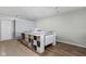 Well-lit basement craft room featuring ample counter space, drawer storage, and vinyl flooring at 649 Hummingbird Dr, Brownsburg, IN 46112