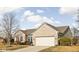Attractive single-Gathering home featuring an attached two-car garage, brick, and a well-kept lawn at 649 Hummingbird Dr, Brownsburg, IN 46112