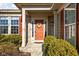 Inviting front entrance with a decorative wreath, side windows, sidelights, and manicured landscaping at 649 Hummingbird Dr, Brownsburg, IN 46112