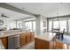 Bright and airy kitchen with eat-in dining, stainless steel appliances, and wooden cabinets at 649 Hummingbird Dr, Brownsburg, IN 46112