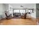 Bright living room featuring hardwood floors, a fireplace, and large windows for natural light at 649 Hummingbird Dr, Brownsburg, IN 46112