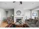 Comfortable living room showcasing a fireplace, hardwood floors, and ample natural light at 649 Hummingbird Dr, Brownsburg, IN 46112