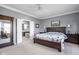 Spacious main bedroom showcasing an attached bath with double doors, and a large bed at 649 Hummingbird Dr, Brownsburg, IN 46112