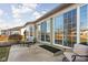 Back patio has an outdoor seating area with views of the yard and sliding glass doors at 649 Hummingbird Dr, Brownsburg, IN 46112
