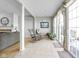 Bright sunroom with tile flooring, large sliding glass doors, and neutral paint colors at 649 Hummingbird Dr, Brownsburg, IN 46112
