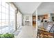 Well-lit sunroom featuring tiled floors, large glass doors, and an open connection to the home at 649 Hummingbird Dr, Brownsburg, IN 46112