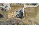 Aerial view of a home with a dark roof, surrounded by a mix of lawn and bare ground in a developing community at 6890 Enclave Dr, McCordsville, IN 46055