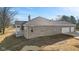 A view of the backyard featuring stone and brick accents, as well as a porch at 6890 Enclave Dr, McCordsville, IN 46055