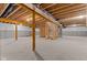 Spacious unfinished basement offers potential with exposed ceiling joists, stud walls, and utilities ready for customization at 6890 Enclave Dr, McCordsville, IN 46055
