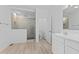 Bathroom with tile shower, vanity sink, toilet, and ample lighting at 6890 Enclave Dr, McCordsville, IN 46055