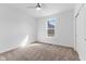 Bright bedroom features a ceiling fan, window, neutral carpet, and closet for a comfortable living space at 6890 Enclave Dr, McCordsville, IN 46055