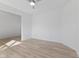 A bright bedroom featuring hardwood floors, a ceiling fan, and ample natural light at 6890 Enclave Dr, McCordsville, IN 46055
