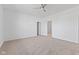Bedroom featuring a ceiling fan, neutral carpet, and doorway with white walls for a relaxing atmosphere at 6890 Enclave Dr, McCordsville, IN 46055