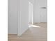 Bright entryway featuring hardwood floors and a white door that fills the space with light at 6890 Enclave Dr, McCordsville, IN 46055