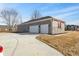 A detached two-car garage with a concrete driveway and well-maintained exterior at 6890 Enclave Dr, McCordsville, IN 46055