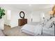 Spacious main bedroom features a dresser and a light gray upholstered bed at 7225 Estes Dr, Indianapolis, IN 46239