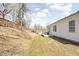 Exterior of home with a sloped backyard featuring a shed and a patio area at 762 Courtney Cir, Danville, IN 46122