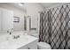 Clean bathroom featuring a white vanity, mirror, toilet, and a patterned shower curtain at 762 Courtney Cir, Danville, IN 46122