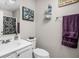 Clean bathroom with a shower, patterned shower curtain, a white vanity, and ample lighting at 762 Courtney Cir, Danville, IN 46122