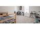 Bright bedroom featuring a gray patterned bedspread, a desk, and a comfortable chair at 762 Courtney Cir, Danville, IN 46122