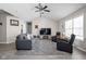 Spacious living room with a vaulted ceiling, neutral paint, a ceiling fan, and laminate floors at 762 Courtney Cir, Danville, IN 46122