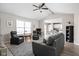 Inviting living room with ceiling fan, vaulted ceiling, and an open layout to the kitchen at 762 Courtney Cir, Danville, IN 46122
