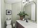 Charming bathroom with stylish vanity, decorative mirror, and a modern toilet at 83 W Garfield Ave, Martinsville, IN 46151