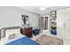 Tranquil bedroom boasts a ceiling fan, natural light, and ample storage for a serene and organized space at 83 W Garfield Ave, Martinsville, IN 46151