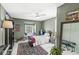 Charming bedroom features white floors, a window seat, and elegant decor creating a warm and inviting space at 83 W Garfield Ave, Martinsville, IN 46151
