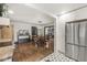 Open floor plan featuring a dining area with wood table and floors connecting to the kitchen at 83 W Garfield Ave, Martinsville, IN 46151