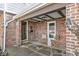 Charming front porch with stone floor and chairs at 83 W Garfield Ave, Martinsville, IN 46151