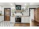 Charming kitchen with white cabinets, wood counters, stainless steel appliances, and decorative tile flooring at 83 W Garfield Ave, Martinsville, IN 46151