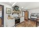 Charming kitchen with white cabinets, butcher block counters, and decorative tile flooring at 83 W Garfield Ave, Martinsville, IN 46151