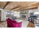 Inviting living room features a brick fireplace and wood-beamed ceiling, creating a warm ambiance at 83 W Garfield Ave, Martinsville, IN 46151