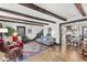 Inviting living room features exposed beams, hardwood floors, and an open floor plan at 83 W Garfield Ave, Martinsville, IN 46151