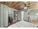 Bedroom features wood paneled walls and access to the ensuite bathroom at 83 W Garfield Ave, Martinsville, IN 46151